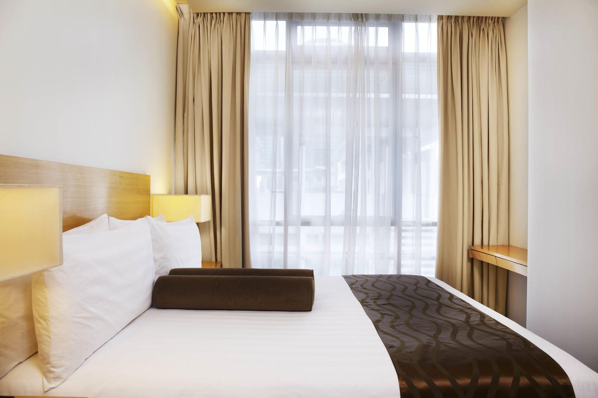 Parkroyal Serviced Suites Kuala Lumpur Exterior foto A bedroom at the hotel