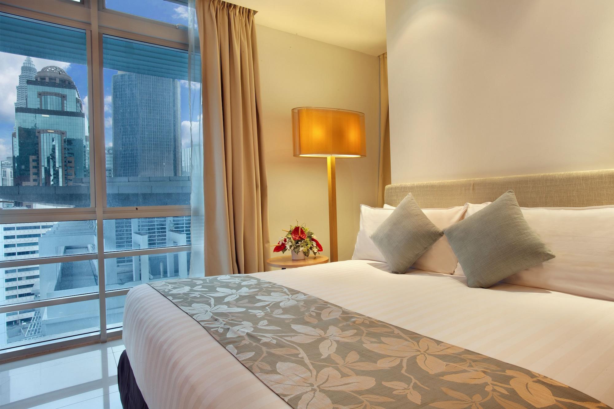 Parkroyal Serviced Suites Kuala Lumpur Quarto foto A bedroom at the hotel