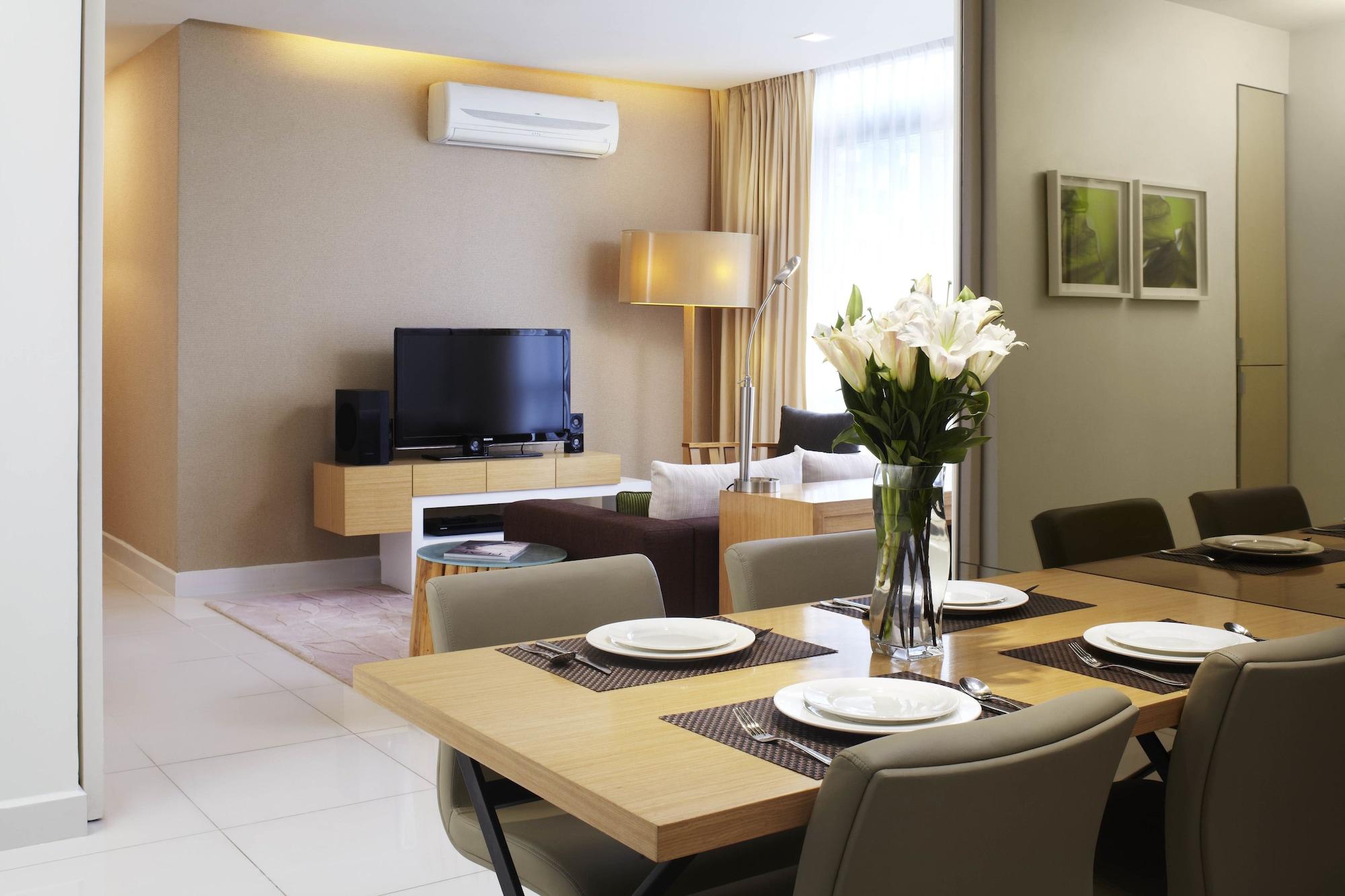 Parkroyal Serviced Suites Kuala Lumpur Exterior foto A living room with a wall-mounted air conditioner